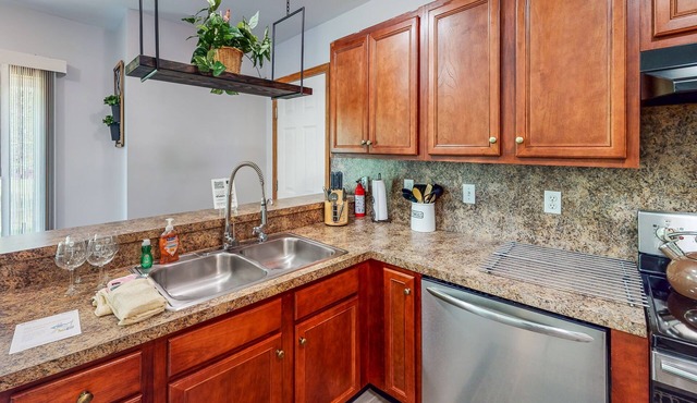 Dog-friendly retreat with fenced yard, billiards, firepit, & pool access