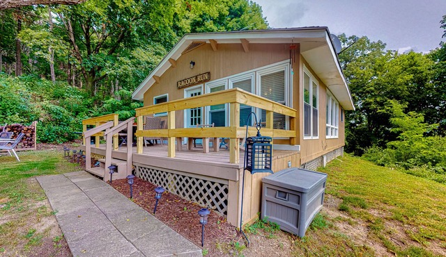 Dog-friendly retreat with close beach access, wood stove, deck, firepit, & AC