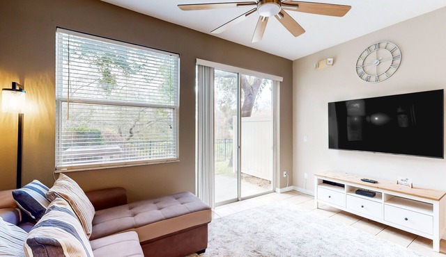 Dog-friendly townhouse near Disney with outdoor pool, patio, streaming, W/D, AC