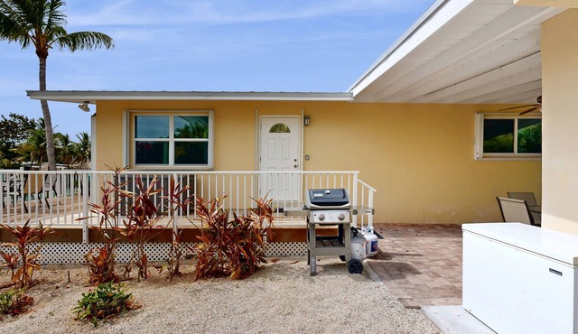 Dog-friendly waterfront home with dock, pool, gas grill, & beach access