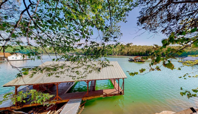 Dog-friendly waterfront home with a firepit, grill, deck, board games, & dock