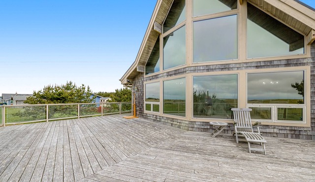 Dog-friendly, waterfront getaway w/ a fireplace, furnished deck, & enclosed yard
