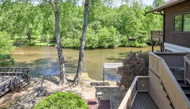 Dog-friendly waterfront condo with furnished patio & fireplace - right in town