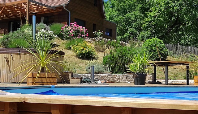 Dordogne Valley Lot timber-frame house set in greenery.