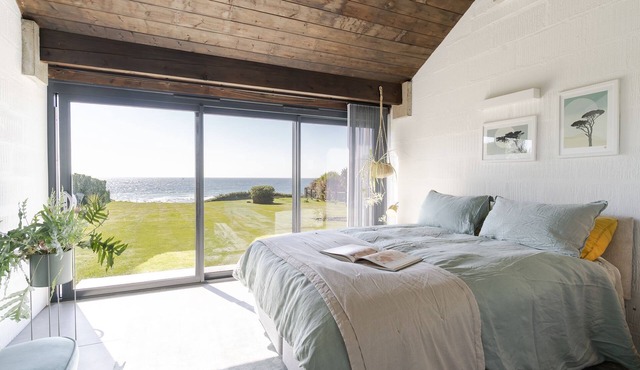 Downderlin is a light-filled beautiful home with a large garden that rolls directly onto the beach.