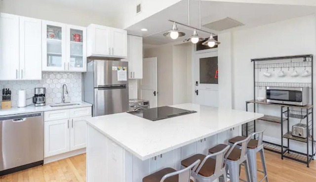 Downtown Digs-View of the City! Stay above local restaurants and nightlife, posh amenities heated toilet seat, oversized rain shower head in glass shower, in-unit laundry, one garage parking spot