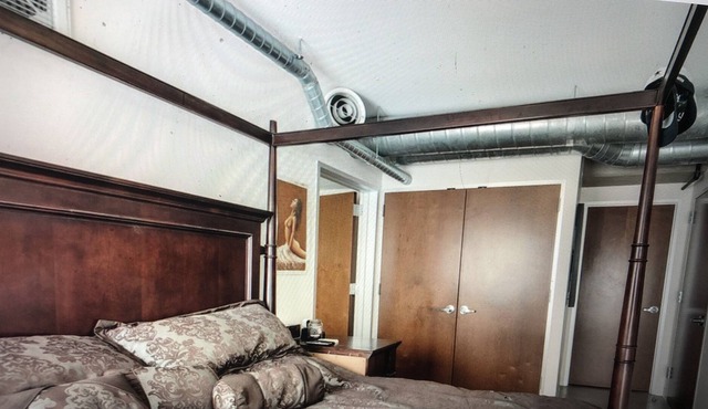 DOWNTOWN HIGH RISE CONDO WITH PATIO, WALKABLE TO EVERYTHING!