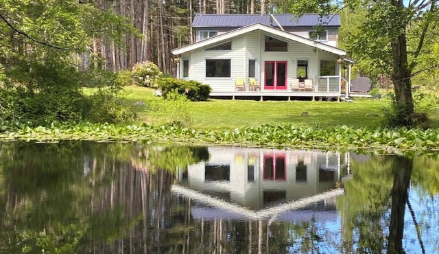 Dragonfly Pond house is a rustic, spacious, light-filled vacation rental home on Orcas Island with high ceilings overlooking a tranquil pond. Clean & comfy. Located in 7 acres of forest, it's peaceful and secluded. Close to town and the ferry.