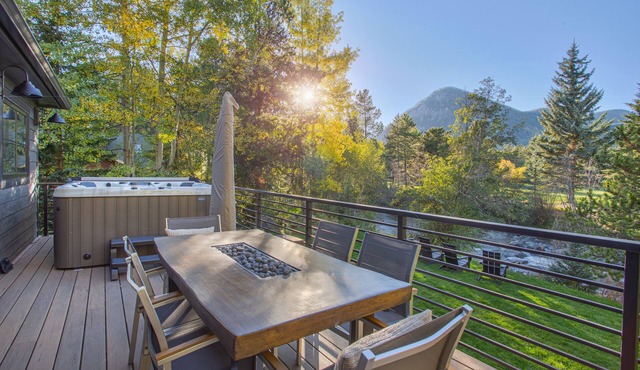 Dreamy home on river, mountain views, steps from town.