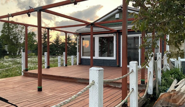 Drift into comfort at the Cozy Current. Your lakeside escape awaits you!