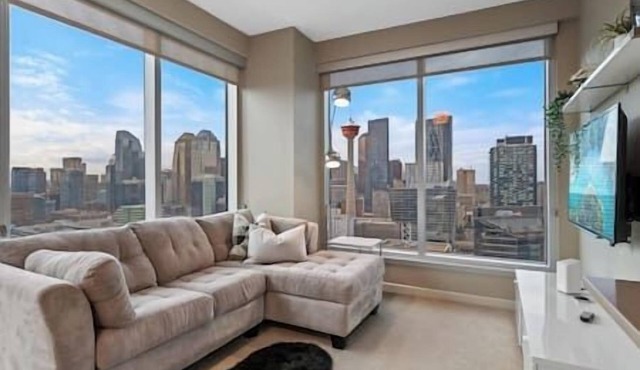 DT Views | Walk to Saddledome| 2BR | UG Parking|AC