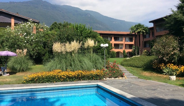 Duplex apartment in well maintained residence with pool and sunbathing area