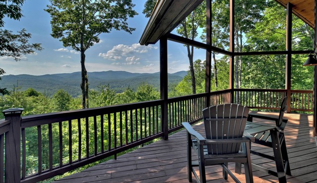 Eagle Ridge, is pet-friendly haven with a full fenced area and offers awe-inspiring mountain views, a bubbling hot tub, cozy outdoor fireplace, and reliable WiFi.