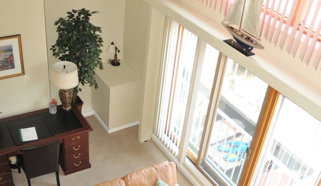 Eastport condo is located in a waterfront community with a community pool & picnic/grilling area