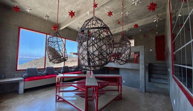 Eclectic Cliffside Den with Hanging Living Area