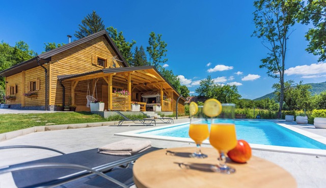 Eco-friendly mountain retreat with pool, jacuzzi, sauna, and panoramic Velebit views.