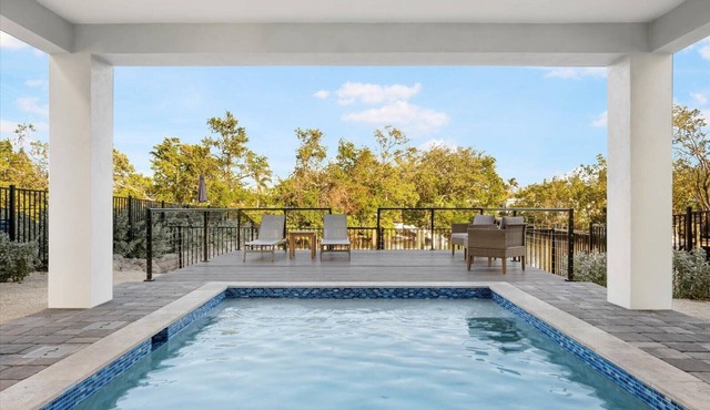 Edgewater Escape: Luxury Eco Canal-Front Home Near Beach with Pool & Dock