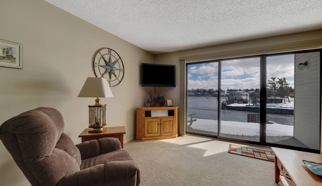 Edgewater Inn 115 | Sunrise Over Lake Charlevoix | Pool, Hot Tub, Sauna