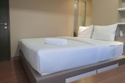 Elegant and Comfortable 1BR at Uttara The Icon Apartment By Travelio