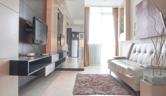 Elegant and Comfy 1BR with Extra Room Apartment at Bellagio Residence