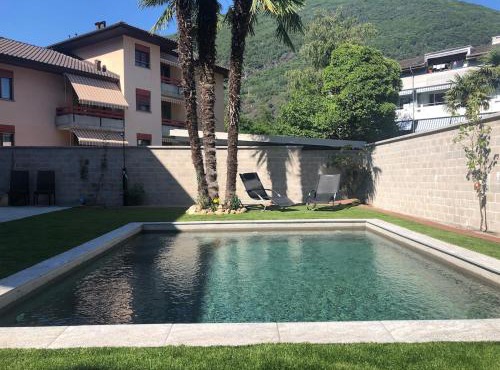 Elegant apartment with pool and parking