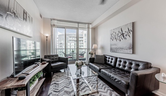 Elegant Downtown Oasis with City and Lake Views Plus Parking!