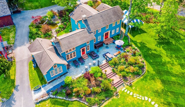 Elegant home with two living areas, a furnished patio, & wood fireplace