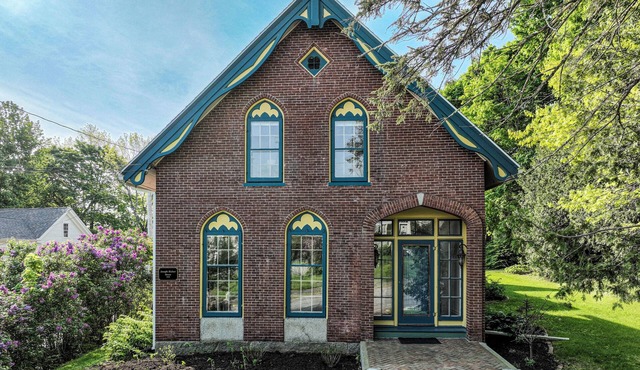 Elegant Victorian Gothic Revival home with wet bar, sunroom, & washer/dryer