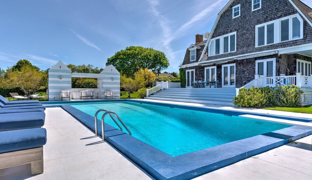 Elegant Watefront home with Oversized Gunite Heated Pool, Tennis, Living.