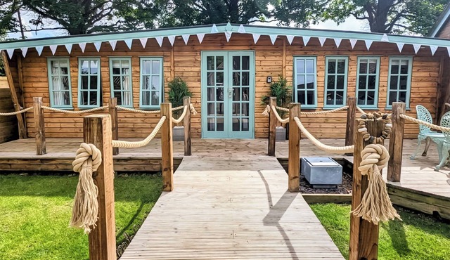 Elegantly finished lodge with a private, decked garden.