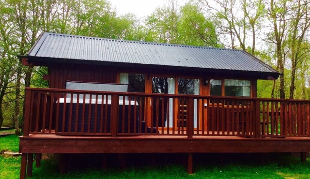 Elevated Loch View Cabin with WiFi, Electric Hot Tub and Mountain Views