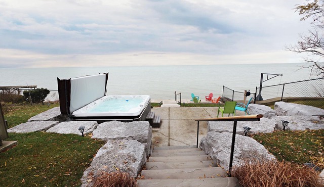 Embrace Lake Erie in our charming 2-story nautical waterfront cottage. n