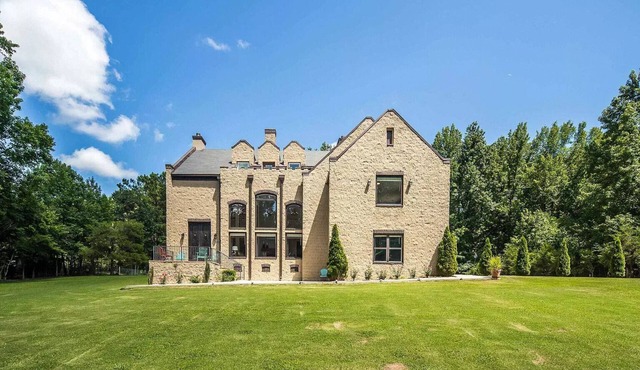 Enchanted Manor: A Luxurious Tudor-Style Retreat Amidst Nature's Splendor