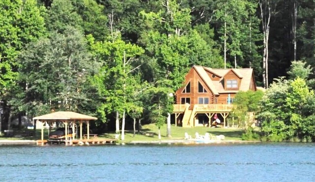 Enchanting 5-Bed/5-Bath Lakefront Log Cabin with Private Cove, Beach & Hot Tub.