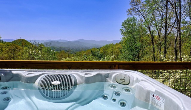 Enchanting dog-friendly alpine escape with hot tub, fireplace, deck, W/D & views