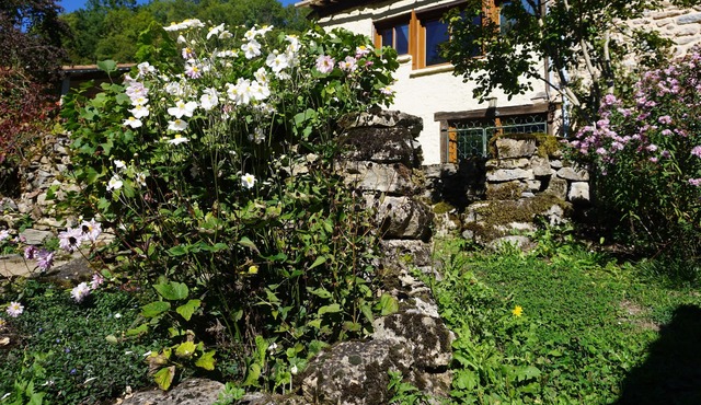 enchanting hamlet house, riverside garden and a terrace.