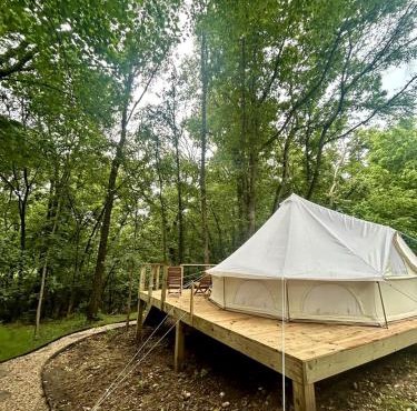 Enchanting Mountain Glamping Tents with Elevated Decks and Fire Pit Near Gentry, AR