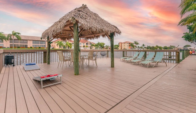 Enchanting tropical waterfront villa with boat slip, bikes, kayaks heated pool!