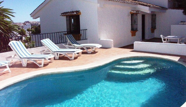 Enchanting villa with private pool and stunning views, close to beach.