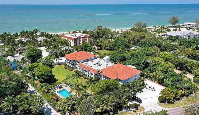 End unit with extra windows. Steps to the beach, private beach access!