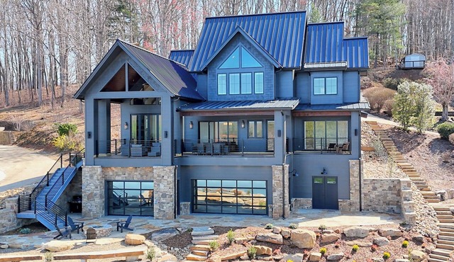 Endless Sunsets by Chatuge Home Concierge | Lakefront home with private dock, covered boat slip, sun deck, bar, fire pit, pool table, and kayaks. The perfect spot to relax, play, and enjoy unforgettable sunset views.