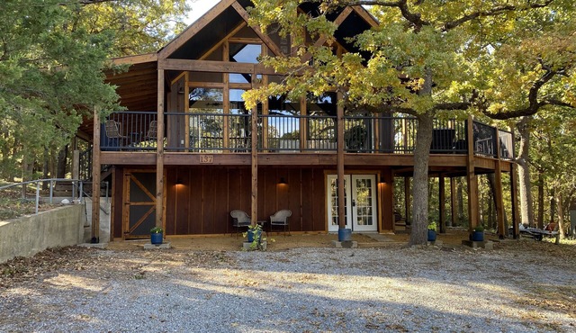 Engaging Texoma tri-story home in the trees with space for all personalities!