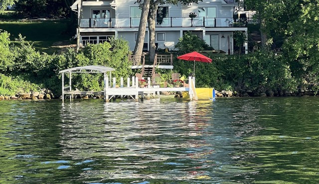 Enjoy 150' Of Lake Frontage Steps From Your Home!