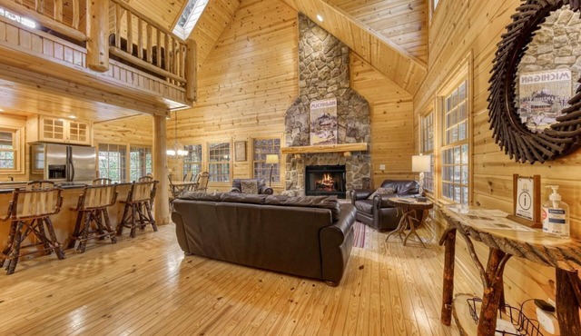 Enjoy a blissful escape to this spacious family cabin with a screened deck with