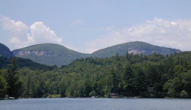 Enjoy a lakefront home in Lake Toxaway with a boat included. Pet-friendly!