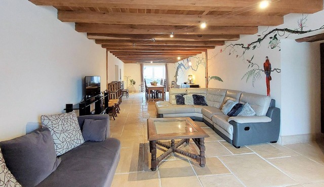 Enjoy a magnificent view of the countryside in this beautiful vacation home with pool.