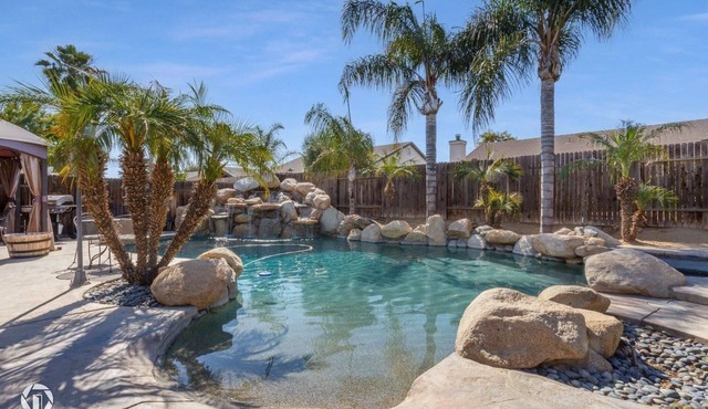 Enjoy a Mini Oasis w/Pool Waterfall 4bd/2ba Home!