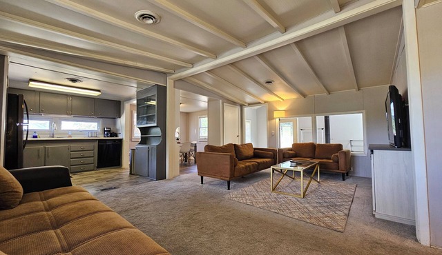 Enjoy a Peaceful environment with neighboring mini pones a fire pit to sit under the stares. roll into the oversized parking lot and enjoy this lovely modern farm home.