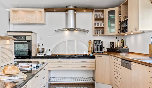 Enjoy a relaxing holiday in this holiday home with sea views near Vejle Fjord.