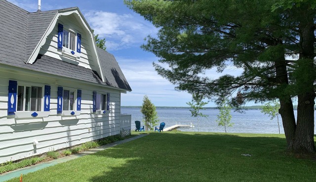 Enjoy all four seasons at the Swiss Chalet located on the shore of Burt Lake.